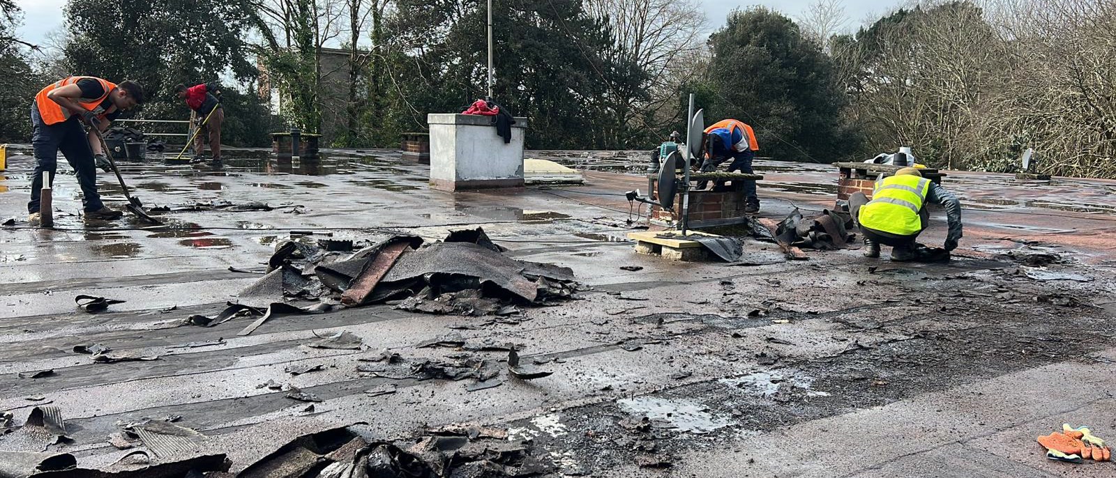 Our roofers stripping a damaged flat roof in Bristol
