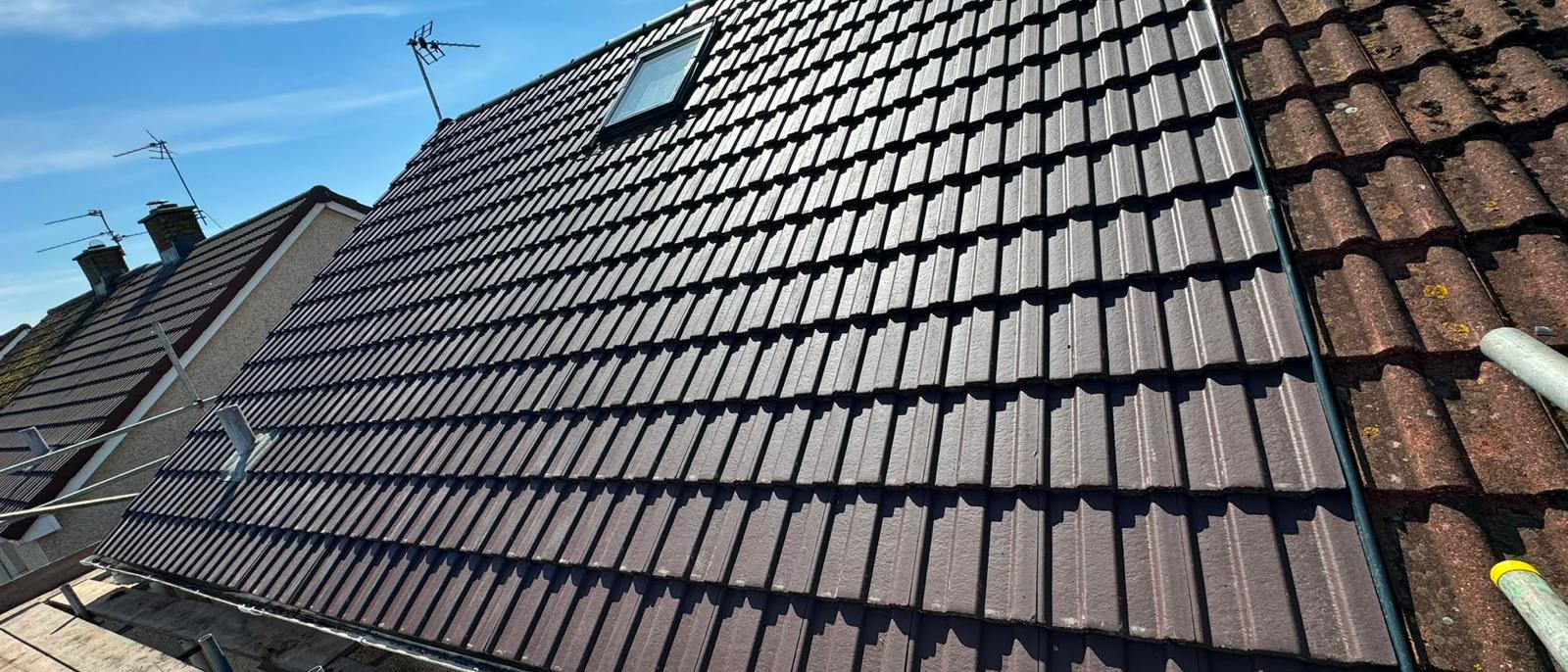 Re-tiled roof finished around a Velux window in Bristol