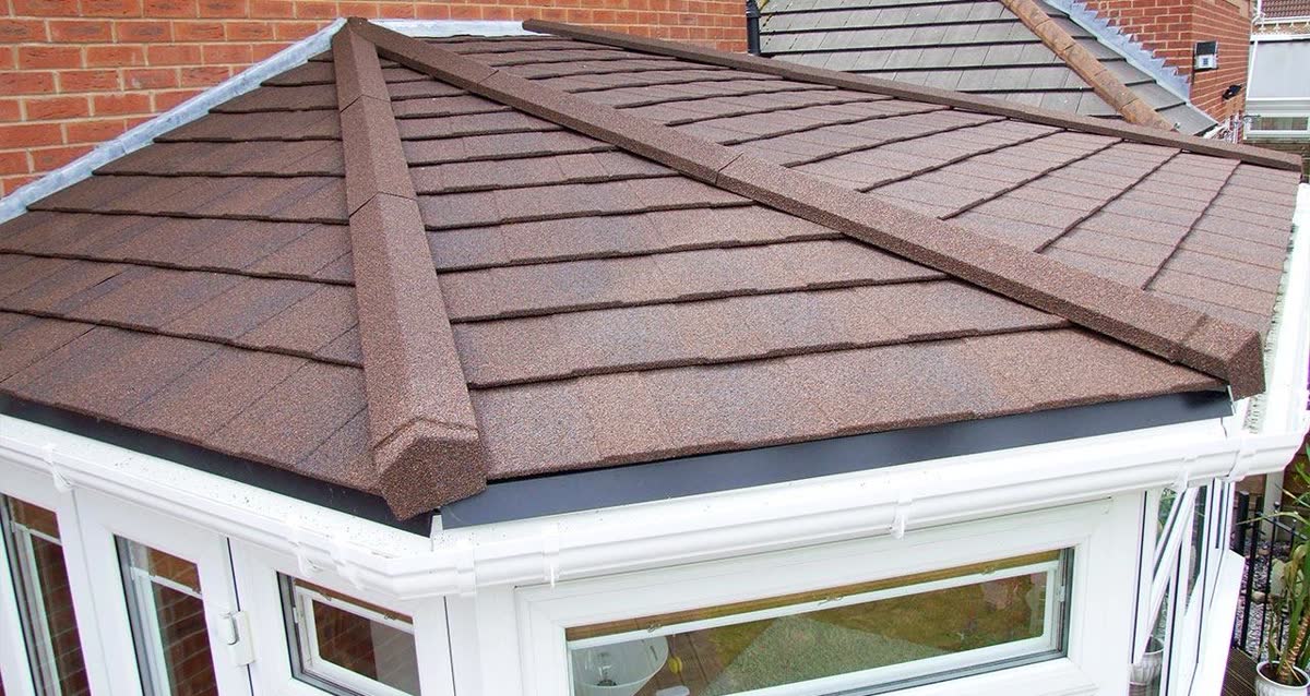 Brown tiled conservatory roof with white trims in Horfield