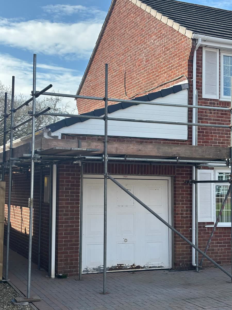 Garage under scaffold ready for roof work in Southmead