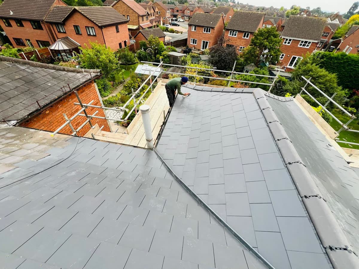 Grey slate roof on a large hipped house in Bristol