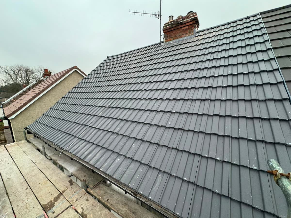 New grey tiles on a roof under scaffold in Staple Hill
