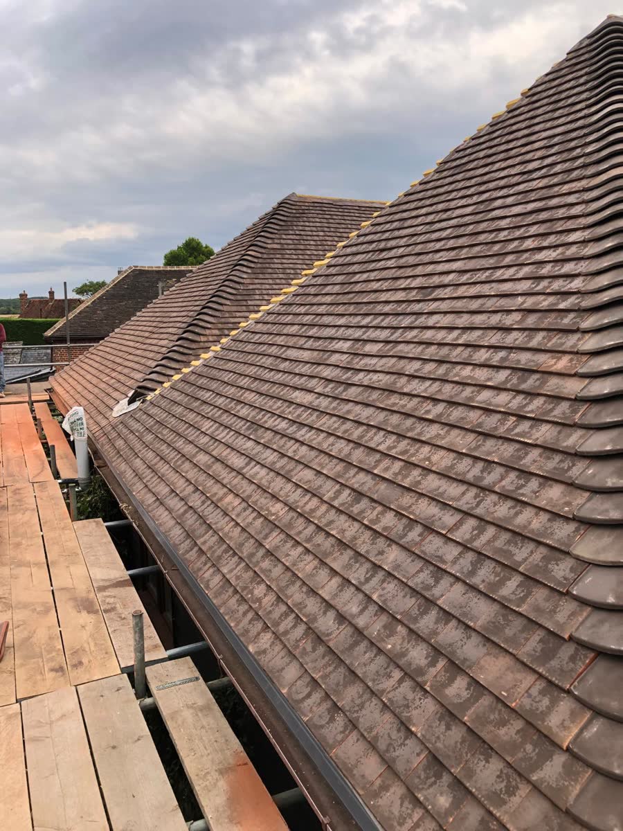Plain tile roof seen along the scaffold in Henleaze