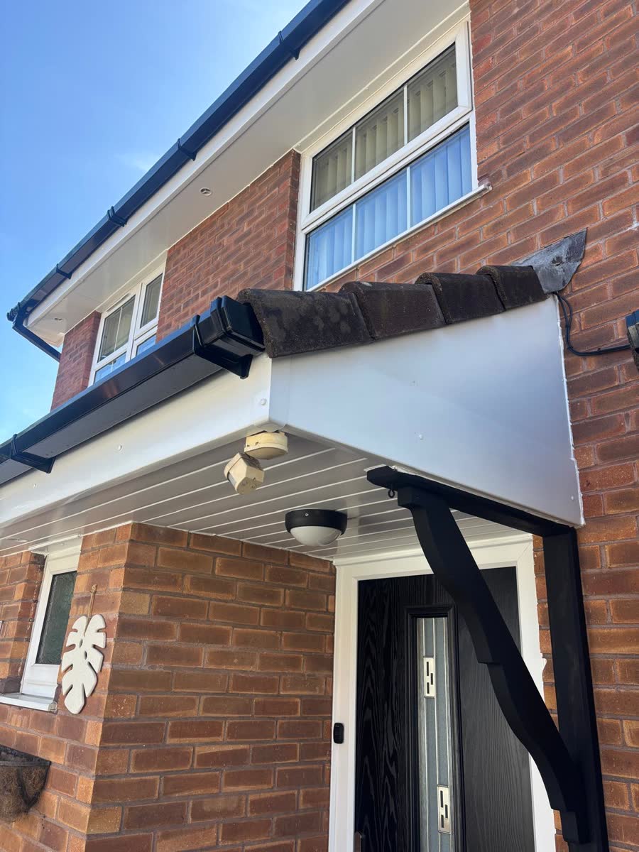 Porch canopy with black fascia and white soffit in Stoke Gifford