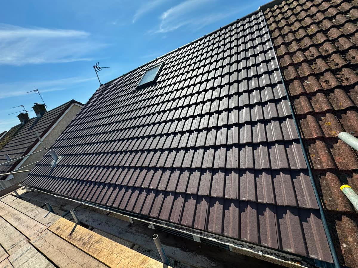 Re-tiled roof finished around a Velux window in Clevedon