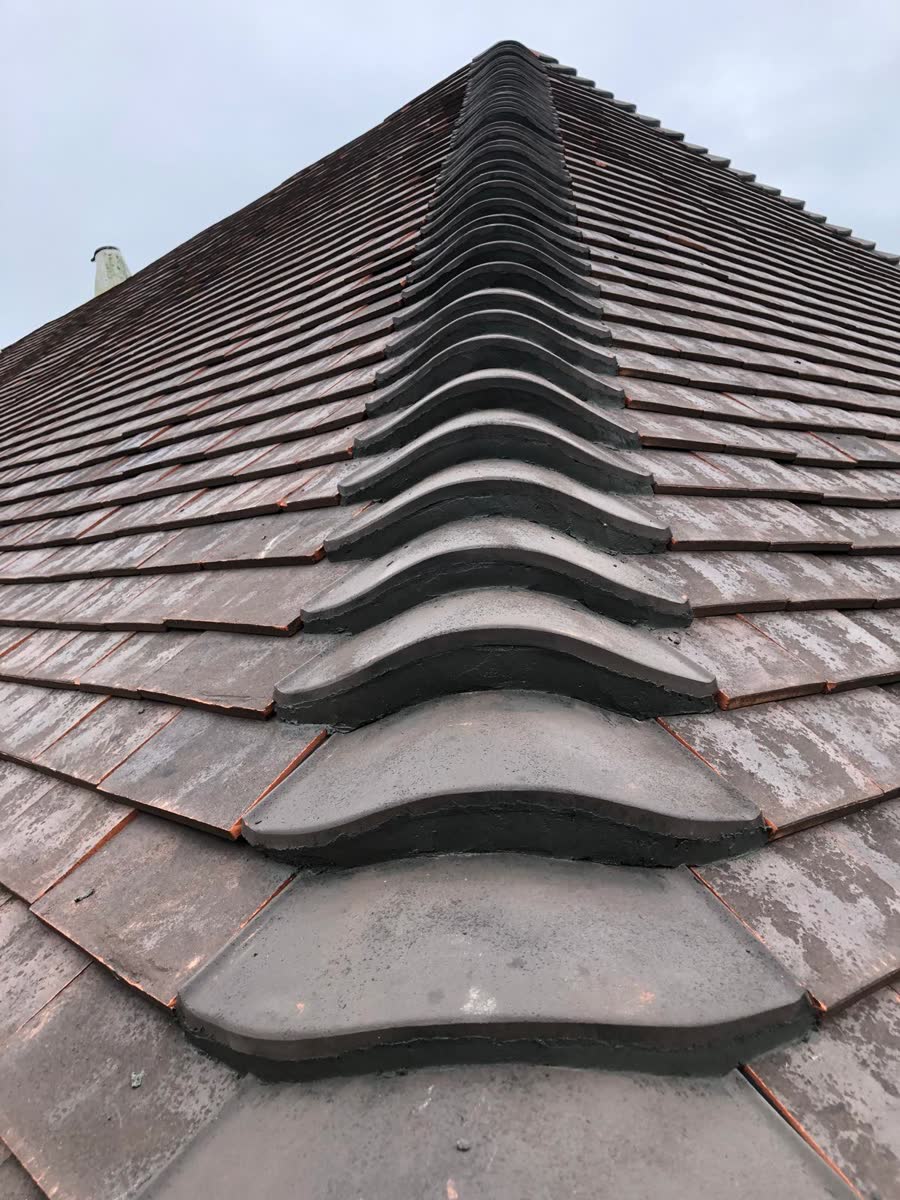 Ridge tiles along a clay tile roof in Westbury-on-Trym