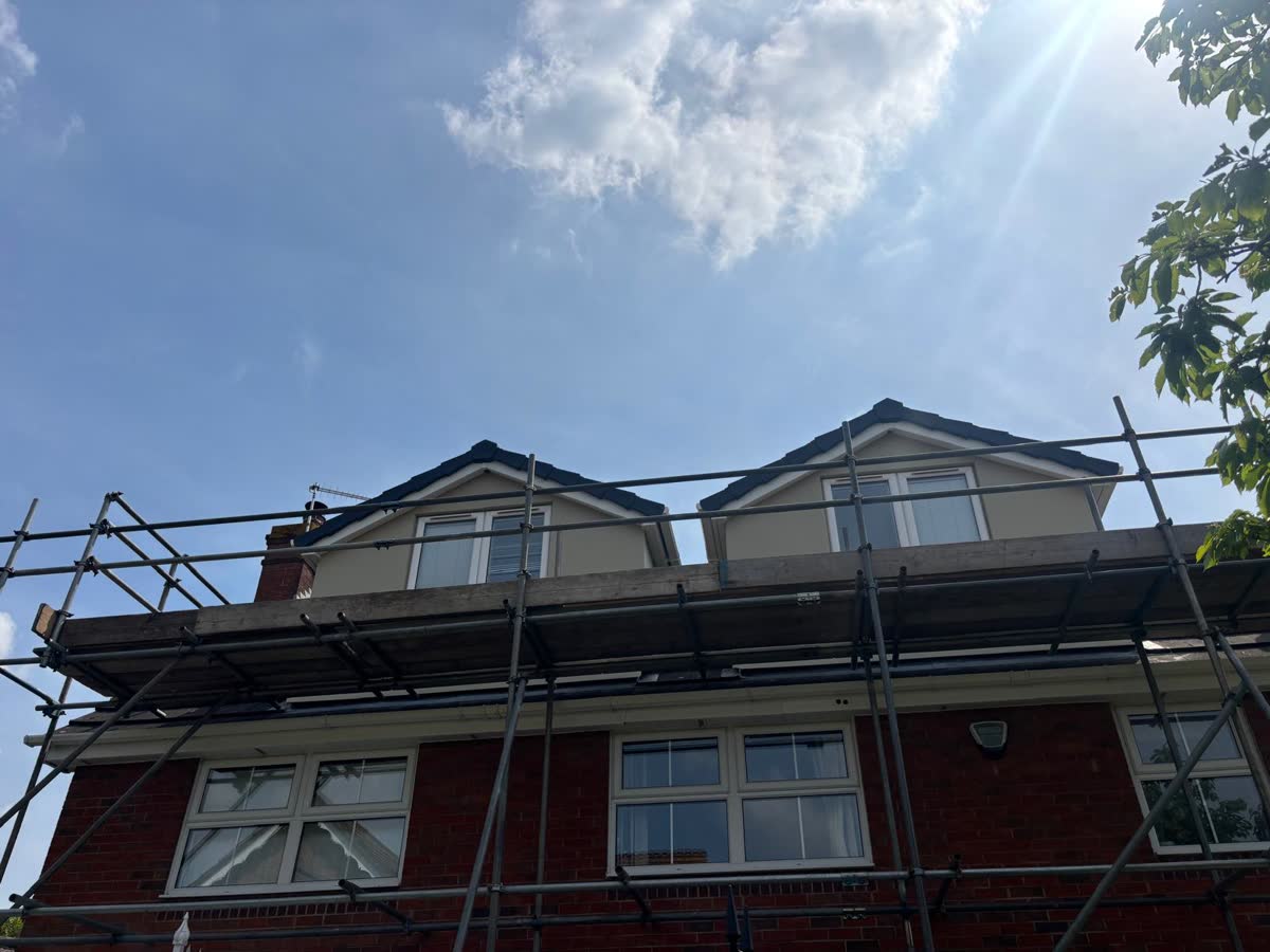 Scaffold up across a house with two dormers in Clifton