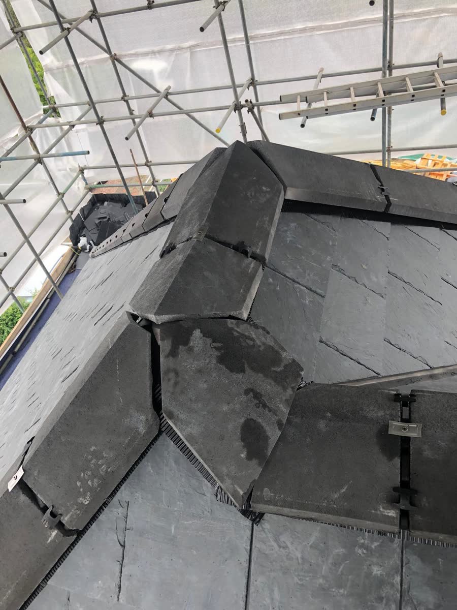 Slate hip ridge being fixed in Downend