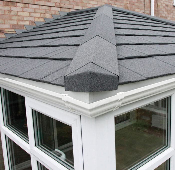 Close view of a grey tiled conservatory roof and ridge, Henleaze