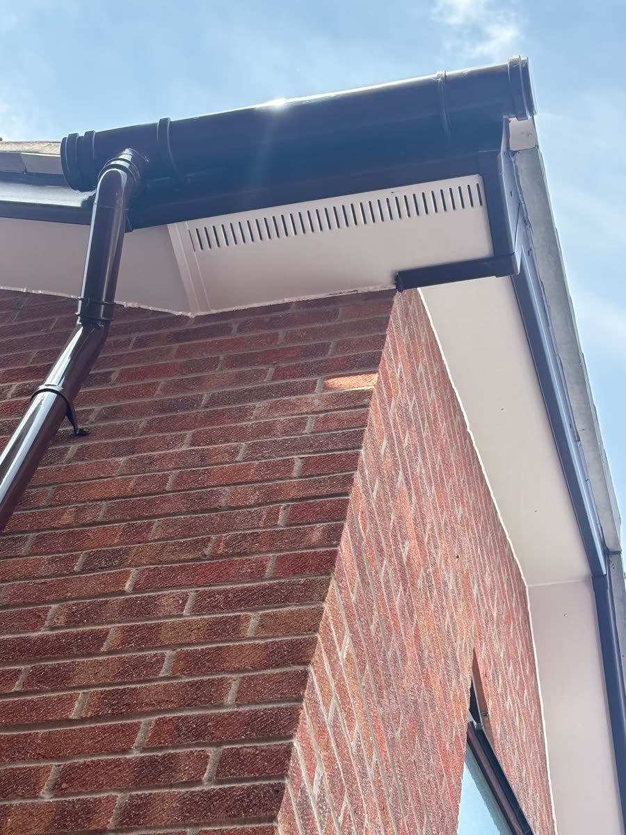 Black guttering and vented soffit on a brick corner, Bradley Stoke