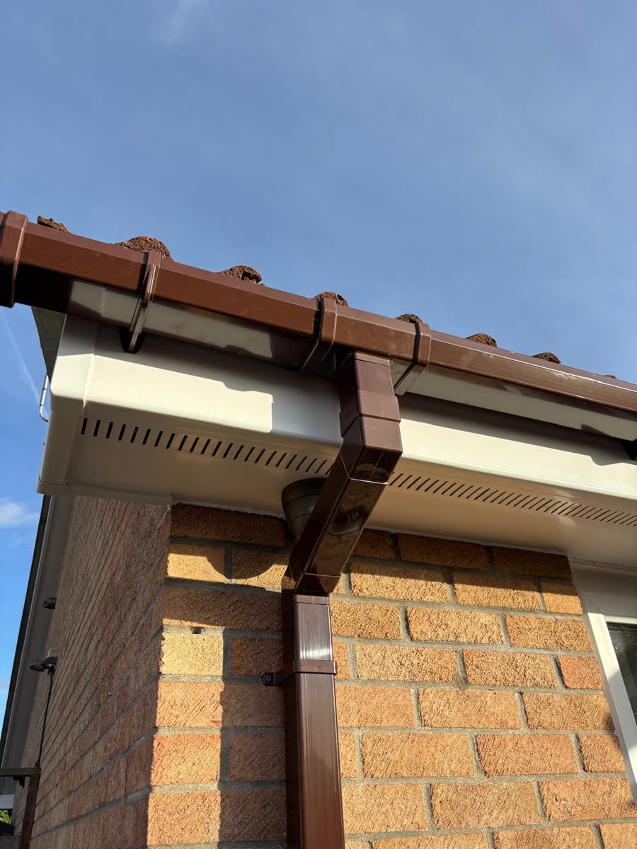 Brown fascia and gutter on a brick house, Clevedon