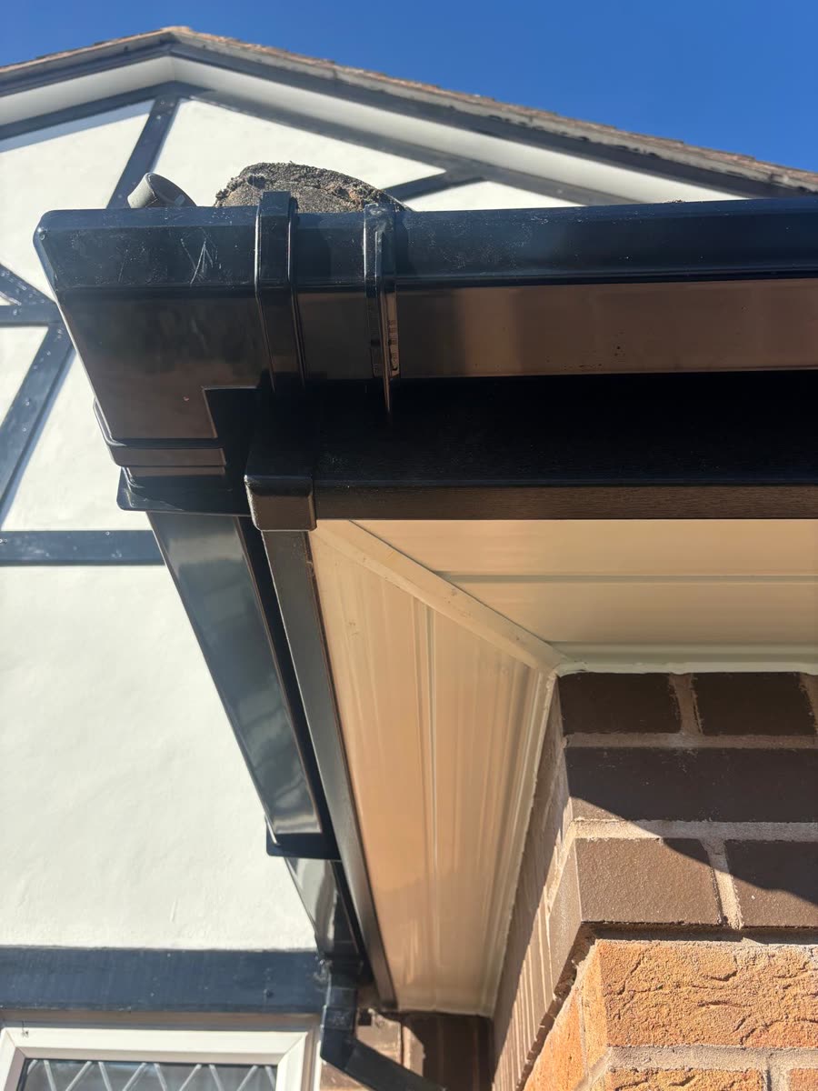 New black fascia and white soffit under the eaves, Kingswood