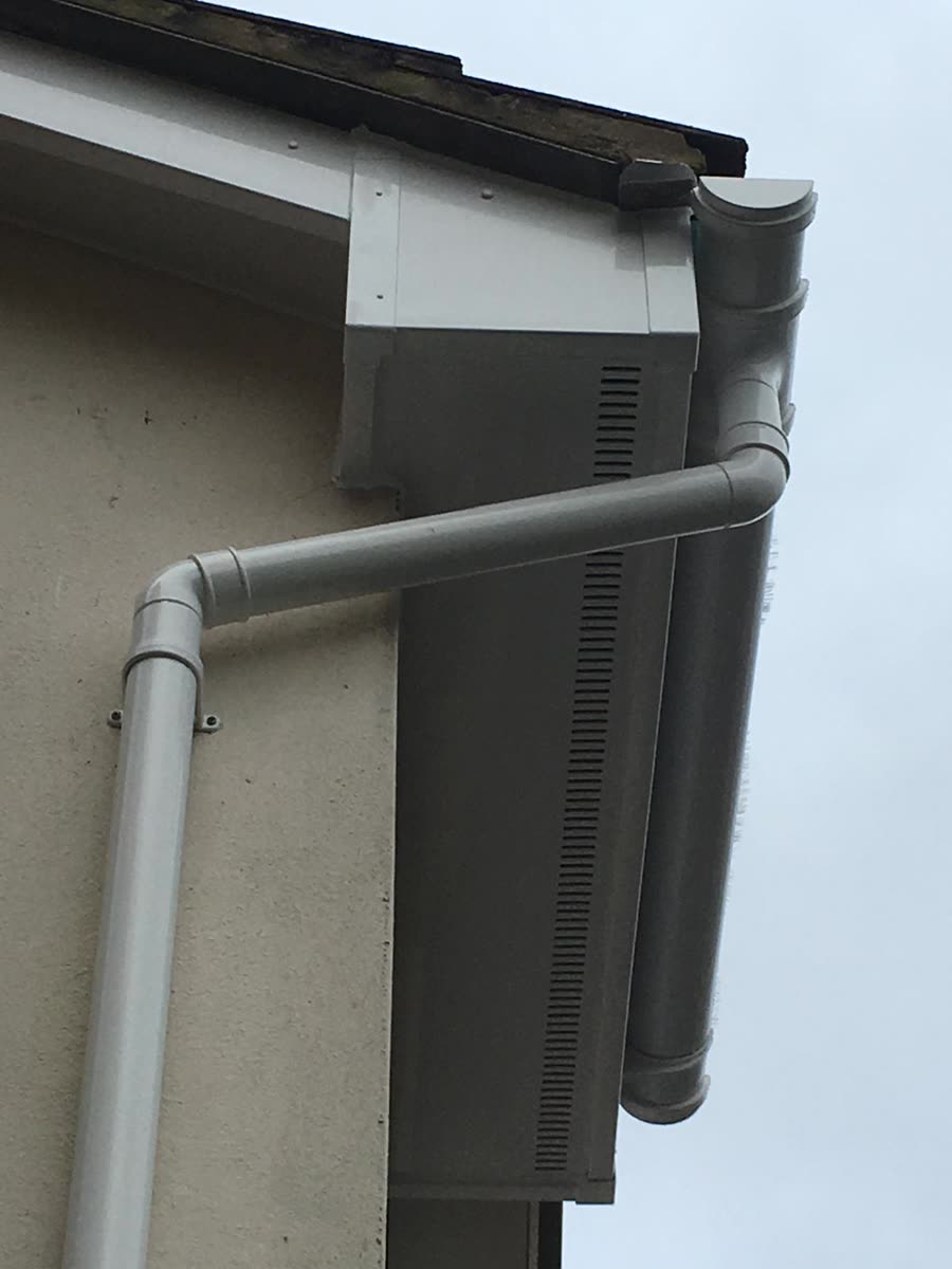 White vented soffit with matching guttering and downpipe, Redland