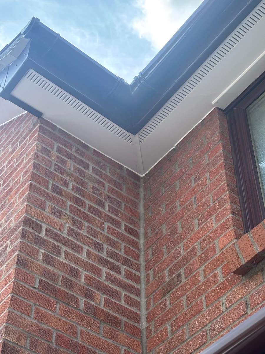 White soffit and black gutter on an internal corner, Sea Mills