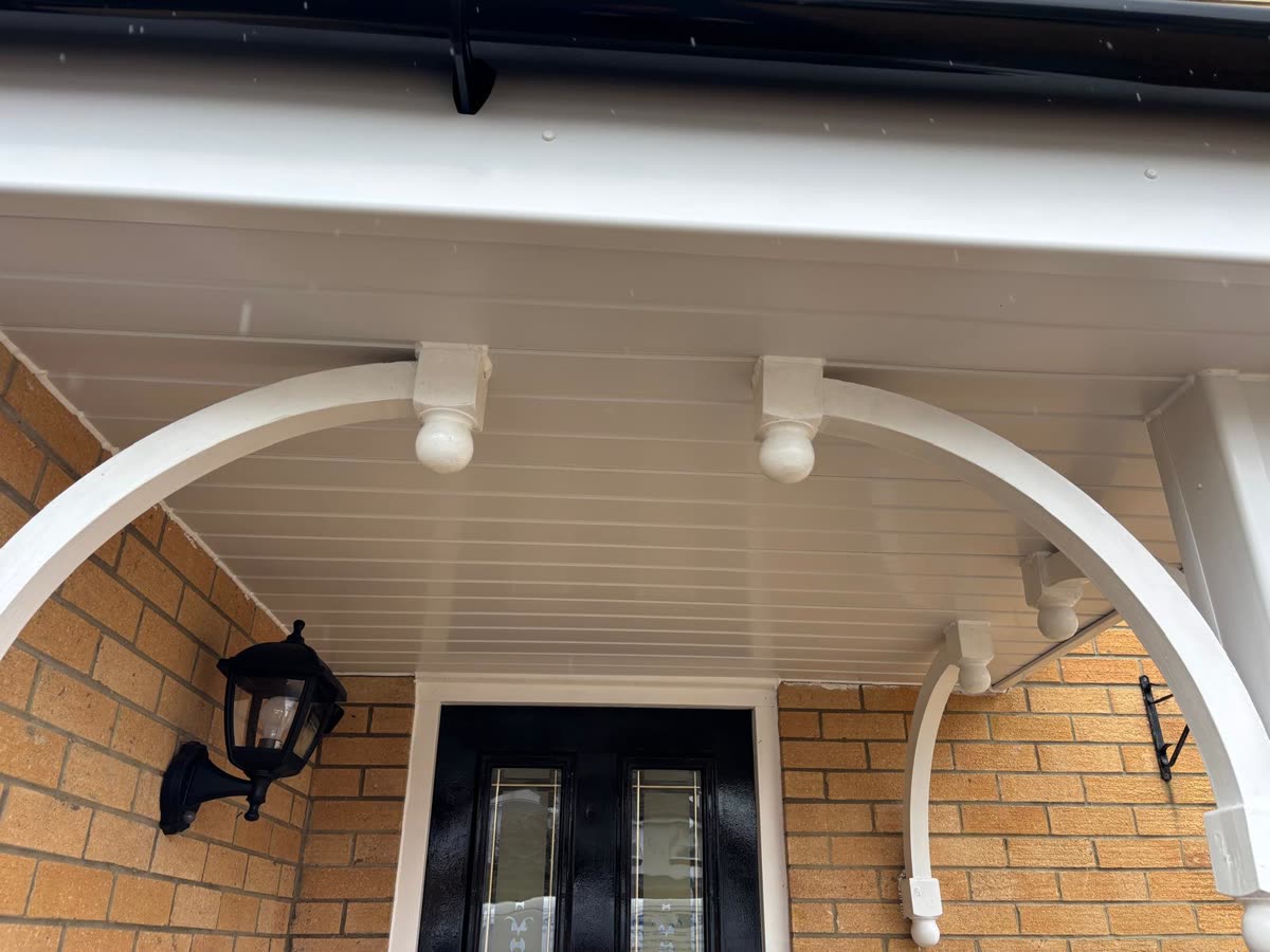 Arched porch canopy finished with new white soffit, Southmead