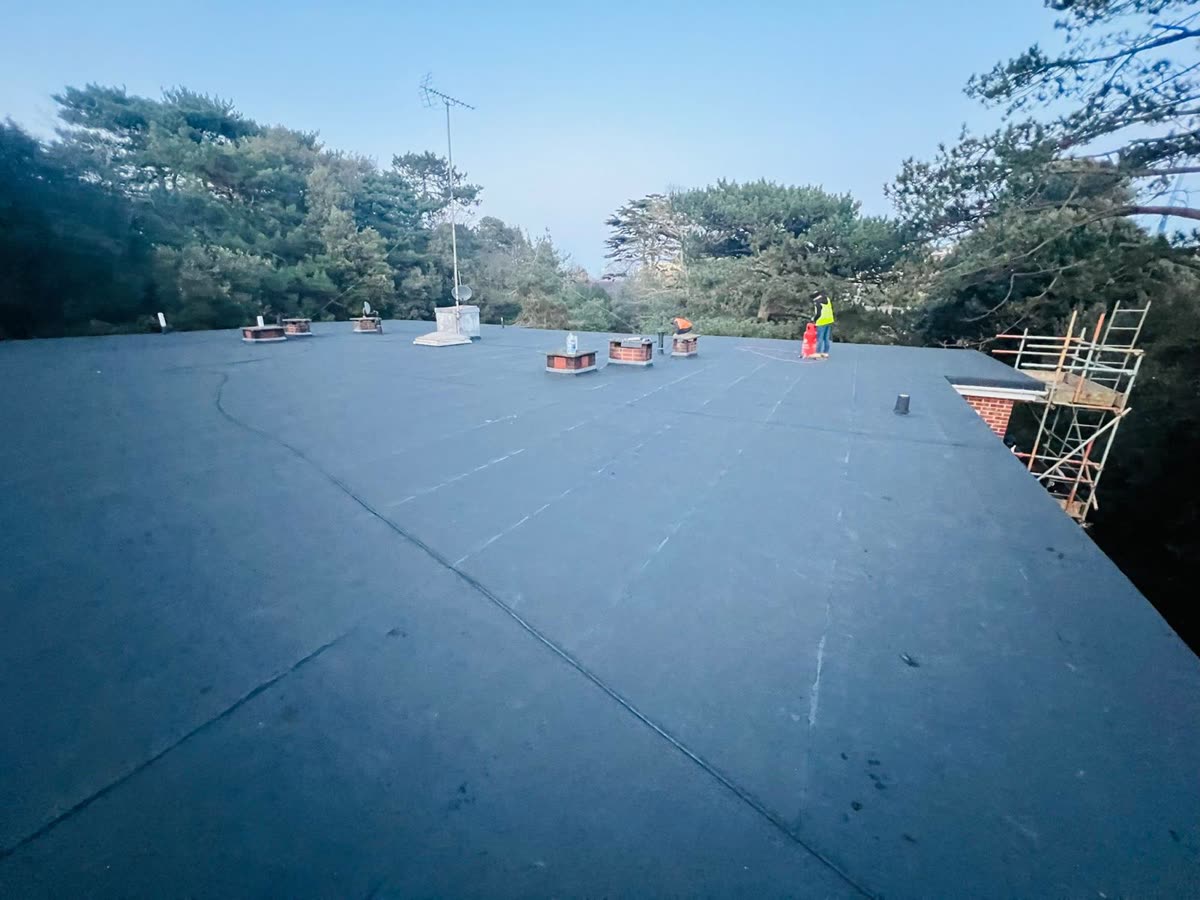 Smooth new flat roof covering finished up to the edges, Filton