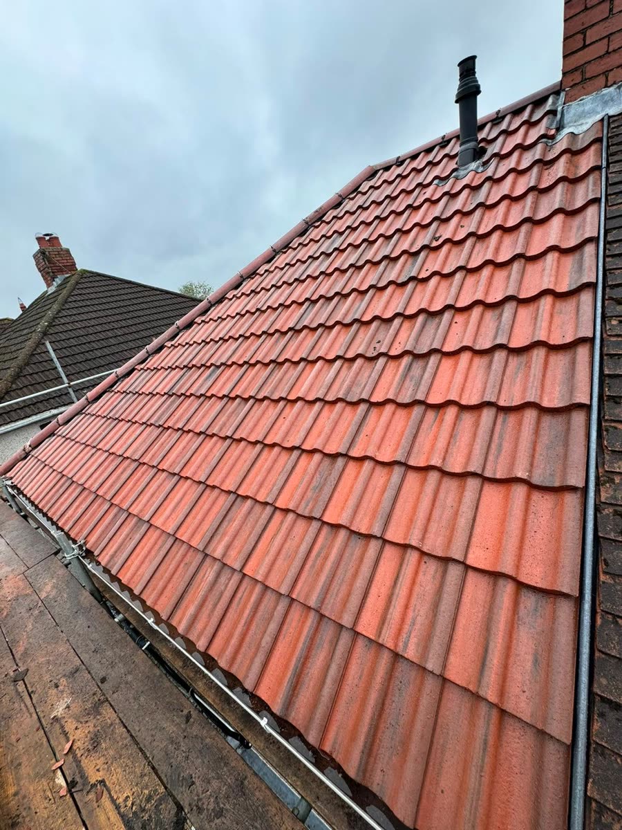 New red interlocking tiles finished on a pitched roof, Pucklechurch