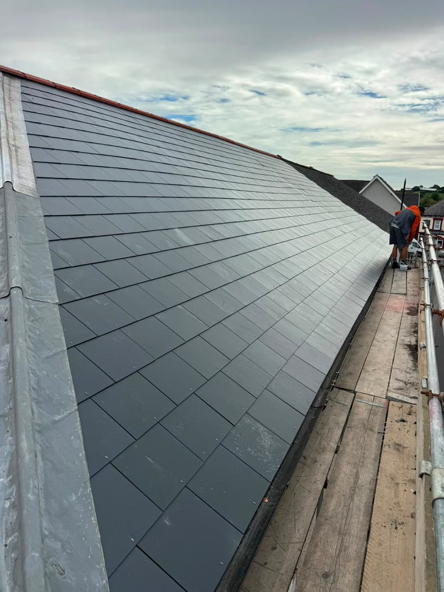 Long run of new slates and ridge on a terraced roof, Long Ashton